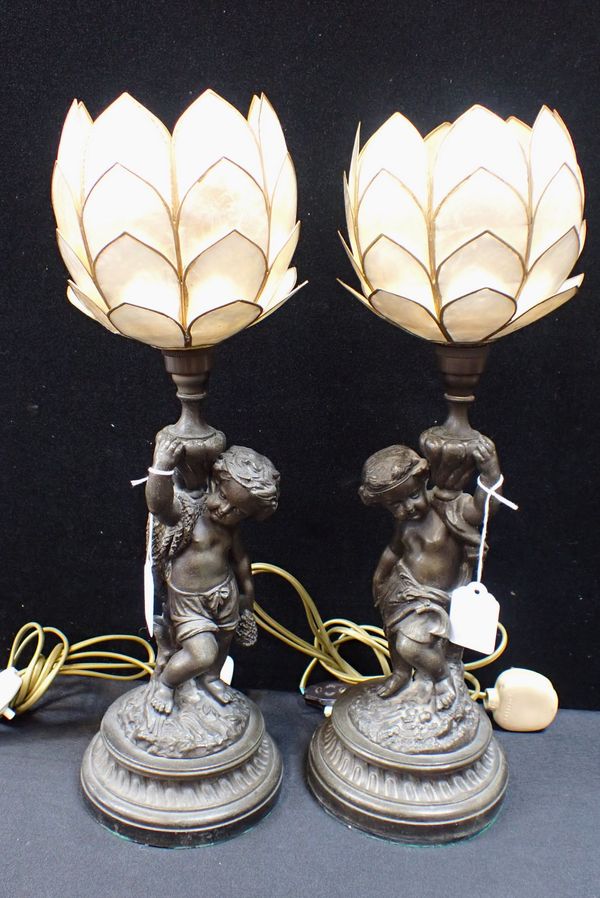 A PAIR OF PUTTO SPELTER TABLE LAMPS