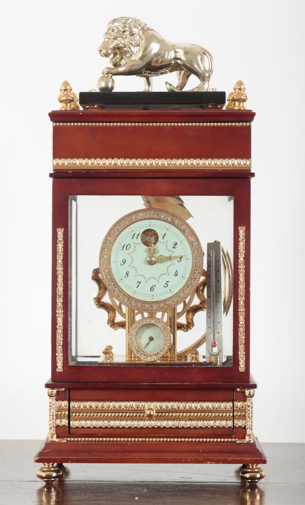 A FRENCH EMPIRE STLYE FOUR GLASS 'FERRIS WHEEL' MANTEL CLOCK AND COMPENDIUM