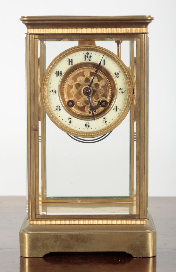 A FRENCH BRASS FOUR GLASS MANTEL CLOCK BY SAMUEL MARTI