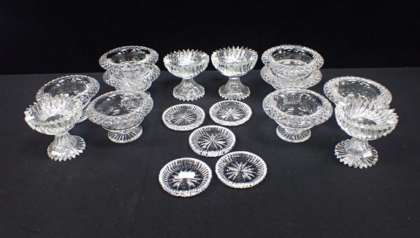 A SET OF EIGHT CUT GLASS CONDIMENT DISHES