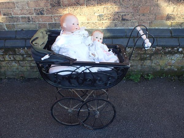 A VICTORIAN STYLE DOLL'S PRAM, AN A M GERMANY BISQUE HEAD DOLL