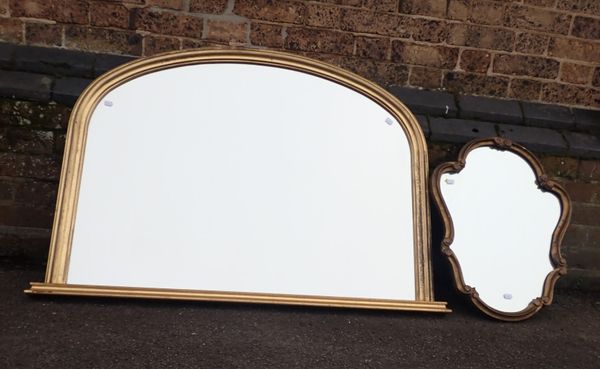 A ROCOCO STYLE GILT CARTOUCHE MIRROR