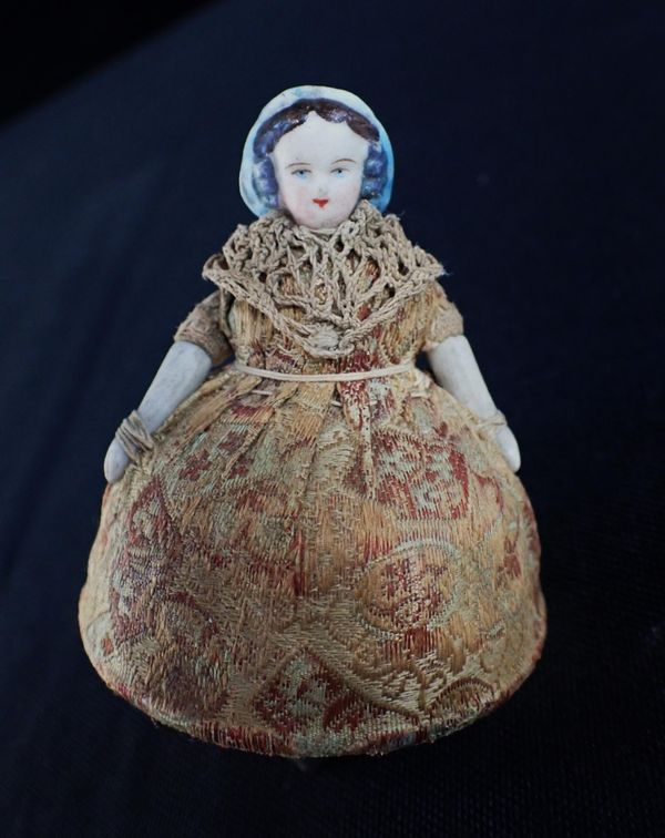 A FRENCH BISQUE HEADED 'TOUPIE' SPINNING TOP DOLL