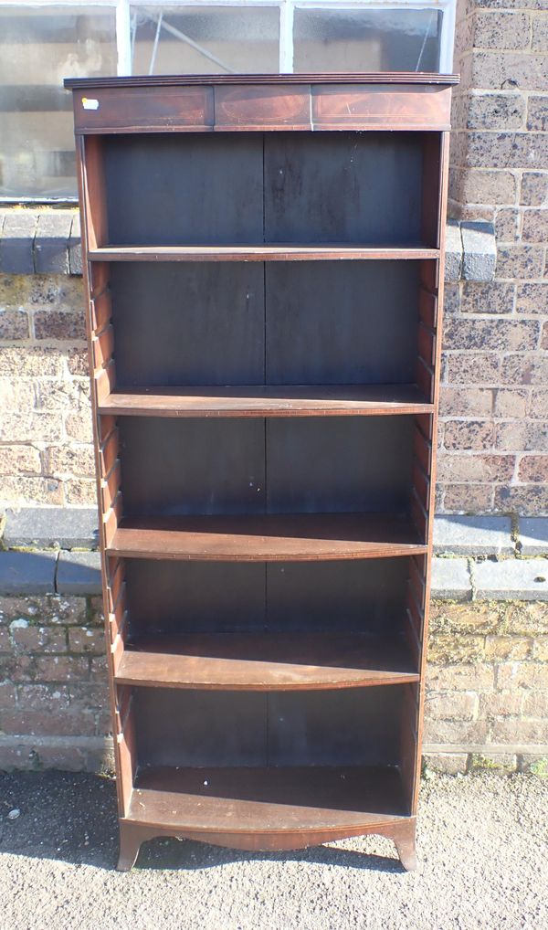 AN EDWARDIAN MAHOGANY BOWFRONT OPEN BOOKCASE