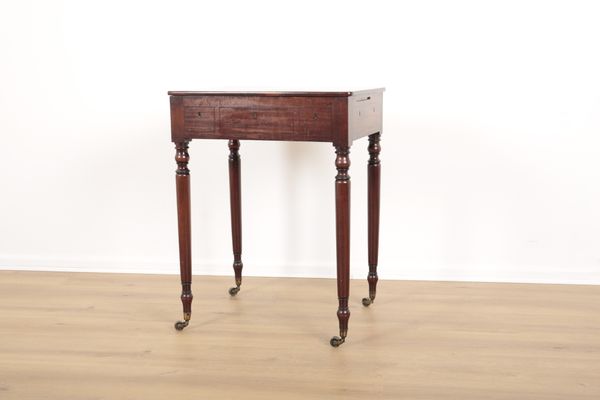 A REGENCY MAHOGANY WRITING TABLE