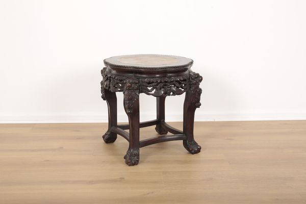 A CHINESE CARVED HARDWOOD VASE STAND