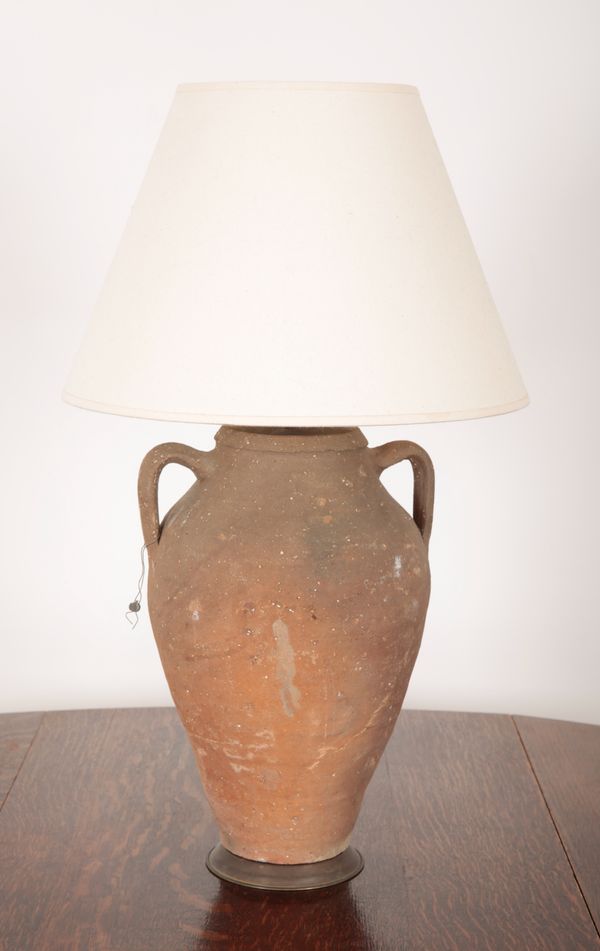 AN EARTHENWARE AMPHORA LAMP