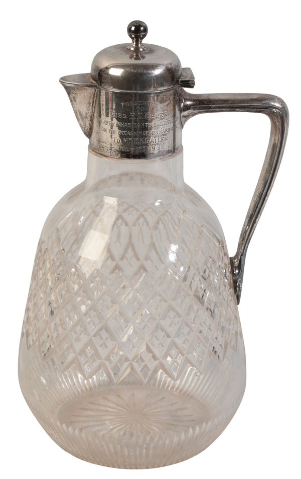 A LATE VICTORIAN SILVER MOUNTED CUT GLASS CLARET JUG