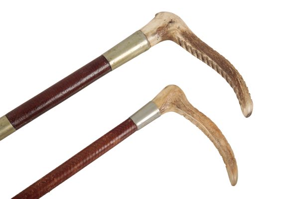 TWO EDWARDIAN ANTLER HEADED HUNTING CROPS