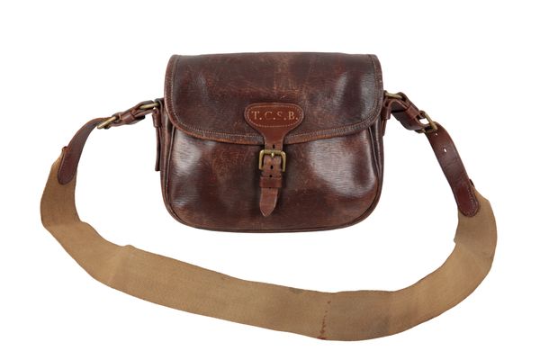 A BROWN LEATHER CARTRIDGE BAG