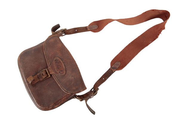 A BROWN LEATHER CARTRIDGE BAG