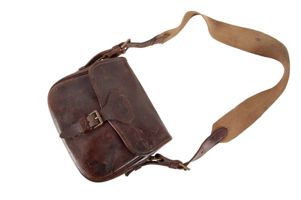 A BROWN LEATHER CARTRIDGE BAG