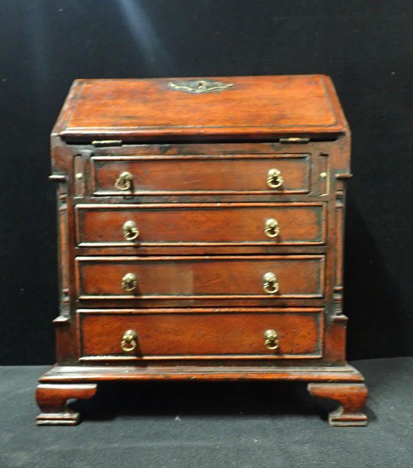 AN EARLY 18th CENTURY STYLE MAHOGANY MINIATURE BUREAU