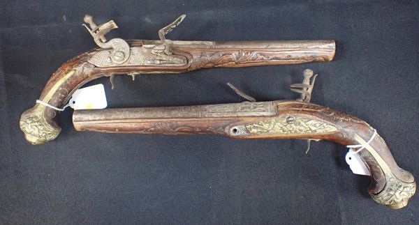 A PAIR OF FLINTLOCK PISTOLS, WITH CARVED STOCK