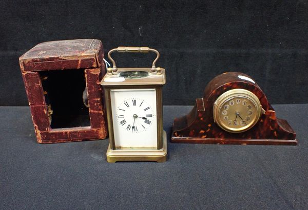 A BRASS CARRIAGE CLOCK, STRIKING ON A GONG