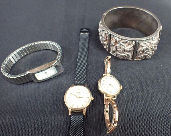 A 9ct GOLD WRISTWATCH, AN INDIAN SILVER BANGLE