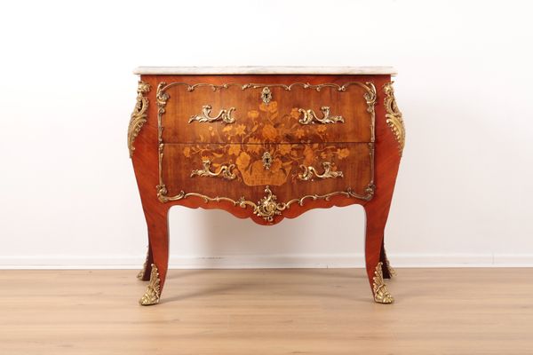 A MARQUETRY AND GILT METAL MOUNTED COMMODE OF LOUIS XVI DESIGN
