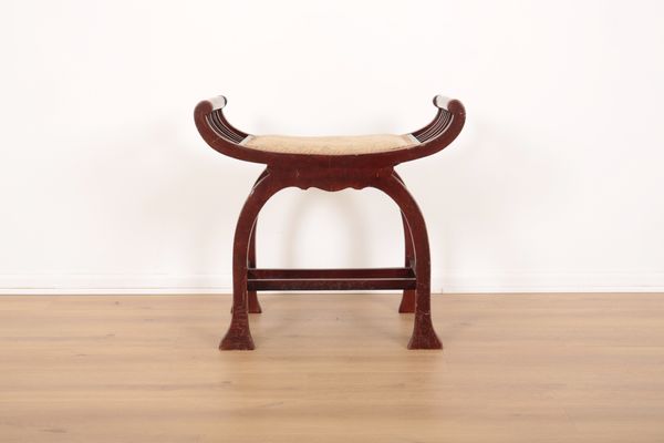 AN EDWARDIAN MAHOGANY X-FRAME STOOL