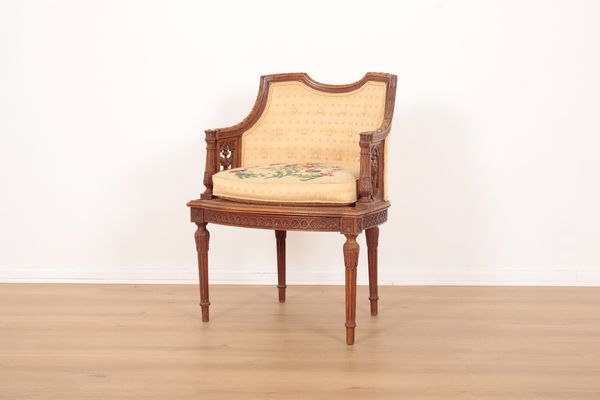 A LOUIS XVI STYLE ARMCHAIR