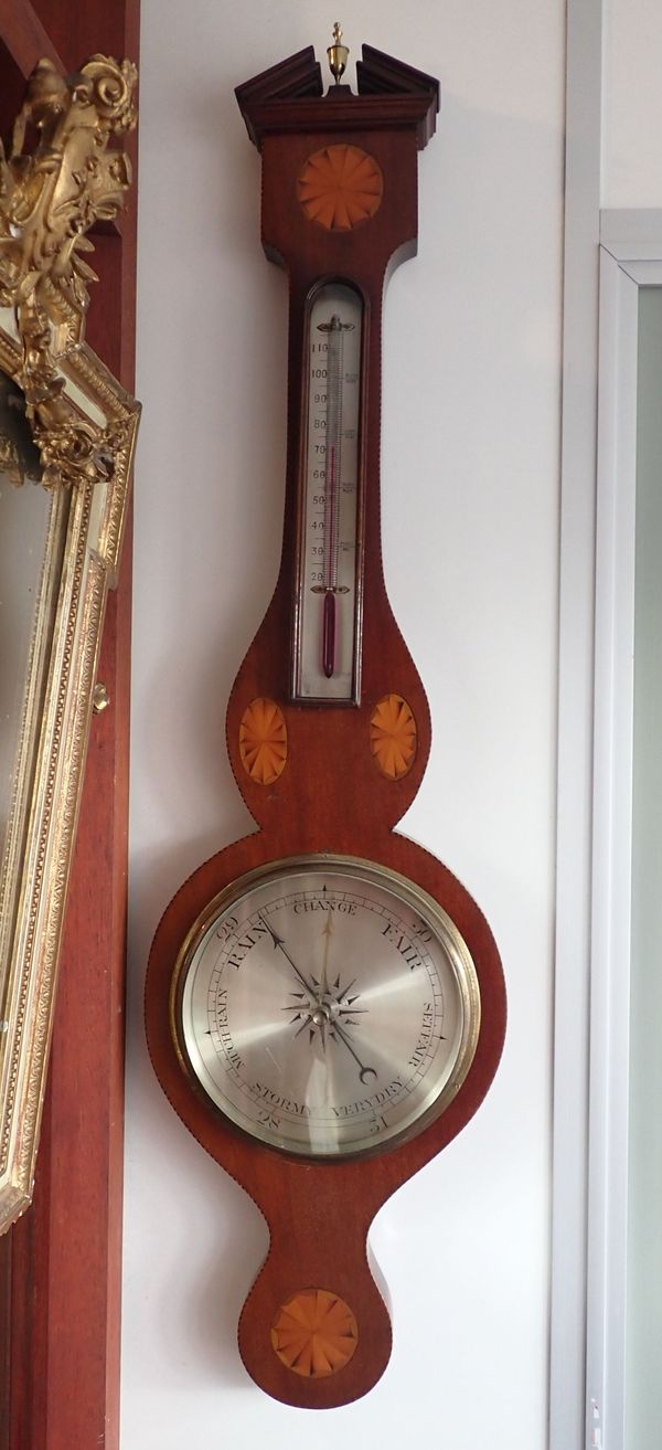 AN EDWARDIAN MAHOGANY CASED BAROMETER