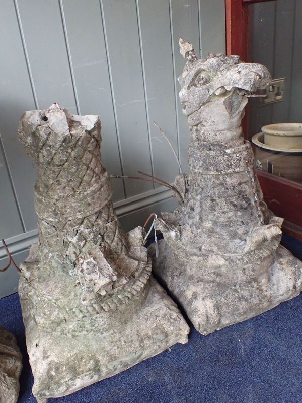 A DAMAGED PAIR OF GOTHIC STYLE GATEPOST GRYPHONS