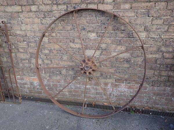 A LARGE IRON WHEEL BY BAMFORDS, UTTOXETER
