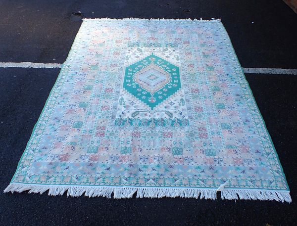 A MOROCCAN RUG, IN PALE COLOURS