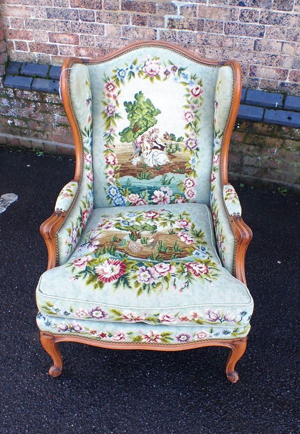 A LOUIS XV STYLE WING ARMCHAIR