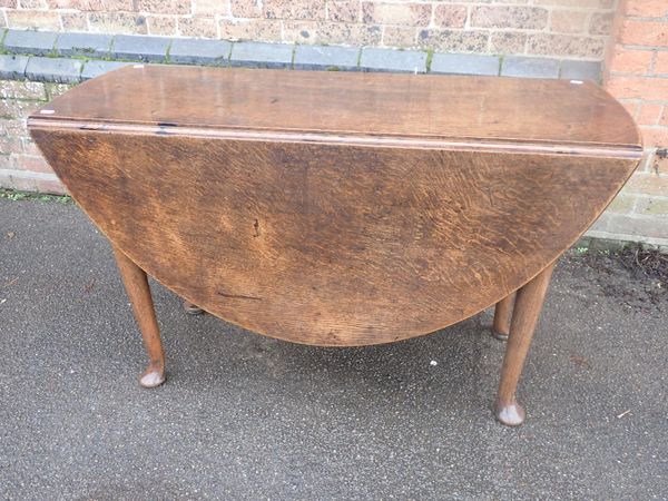 AN GEORGE II OAK OVAL DROP-LEAF TABLE