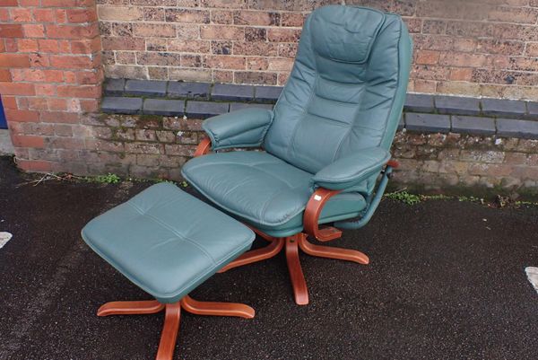 A SWEDISH STYLE RECLINING AND SWIVEL EASY CHAIR