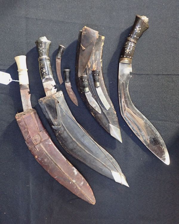 THREE KUKRIS, ONE WITH A BONE HANDLE