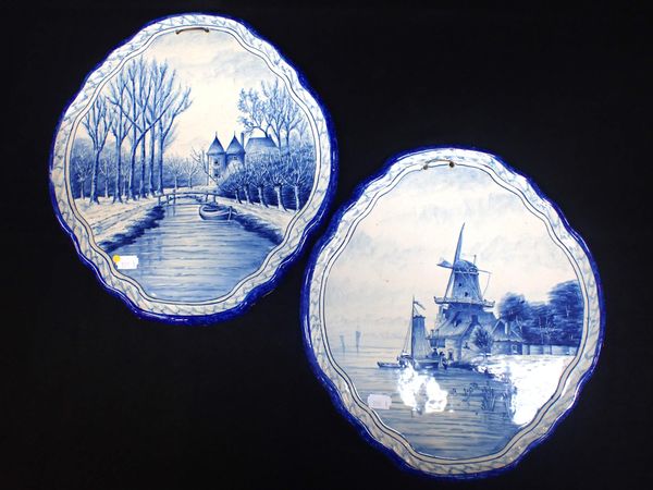 A PAIR OF DELFT STYLE BLUE AND WHITE PLAQUES