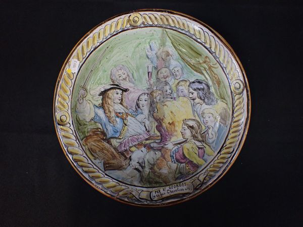 A FAEINCE DISH, SIGNED 'ALB', PAINTED WITH A SCENE