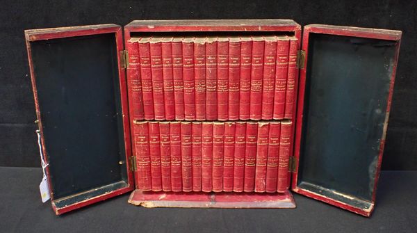 A SET OF RED LEATHER BOUND DICKENS WORKS IN RED LEATHER CASE