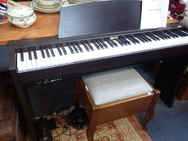 A KAWAI CL25 DIGITAL PIANO, BLACK CASED