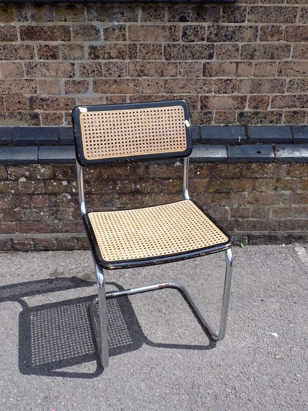 A MID CENTURY CHROMED AND EBONISED WOOD CANTILEVER OCCASIONAL CHAIR