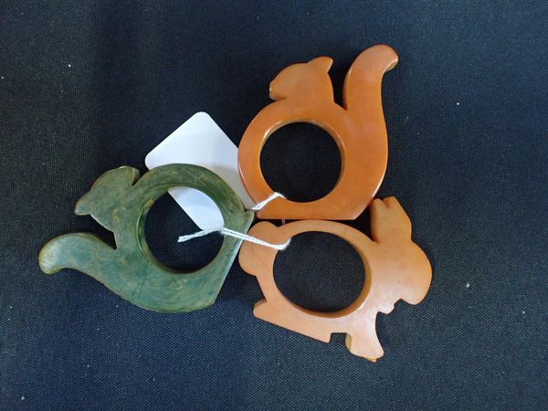 THREE 1930s BAKELITE NAPKIN RINGS