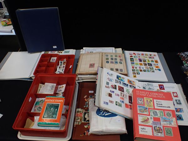 A COLLECTION OF POSTAGE STAMPS, SOME IN ALBUMS