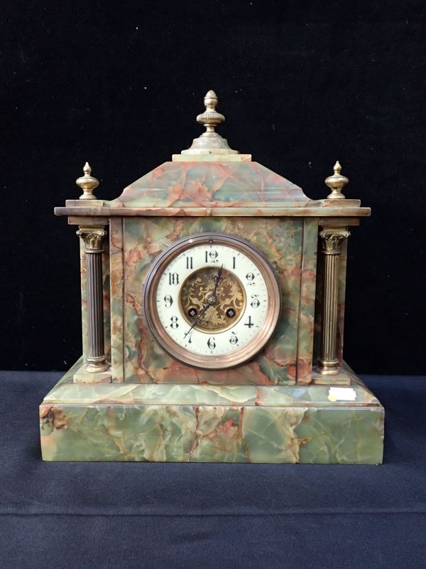 A FIGURED ONYX MANTEL CLOCK