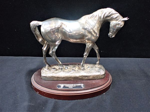 A FILLED SILVER HORSE FIGURE