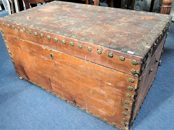 A LARGE 19TH CENTURY TRUNK WITH BRASS ROSETTE STUDS