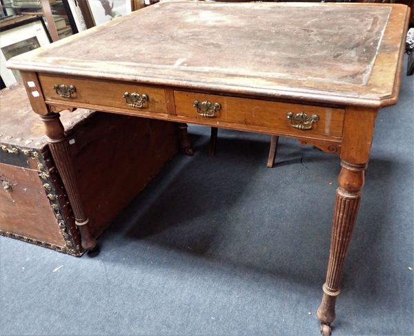 A LATE 19TH CENTURY OAK  LIBRARY WRITING TABLE