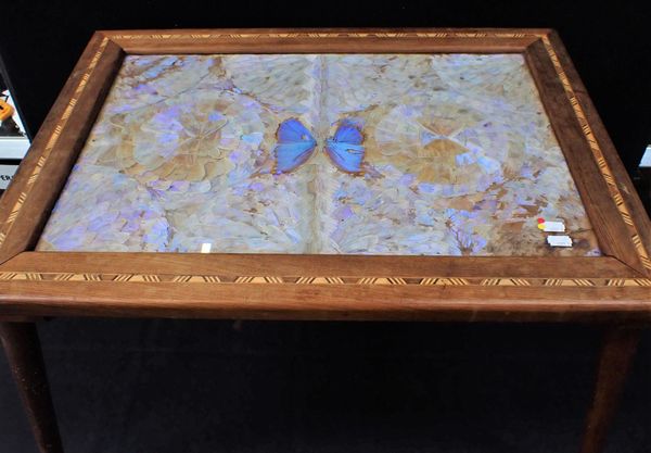 A BUTTERLY WING DECORATED COFFEE TABLE