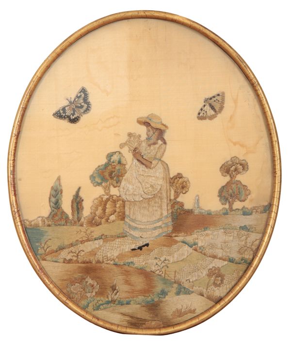 AN EARLY 19TH CENTURY EMBROIDERED SILK OVAL PANEL