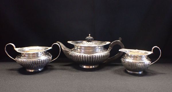 A LATE VICTORIAN SILVER THREE PIECE BACHELORS TEA SERVICE