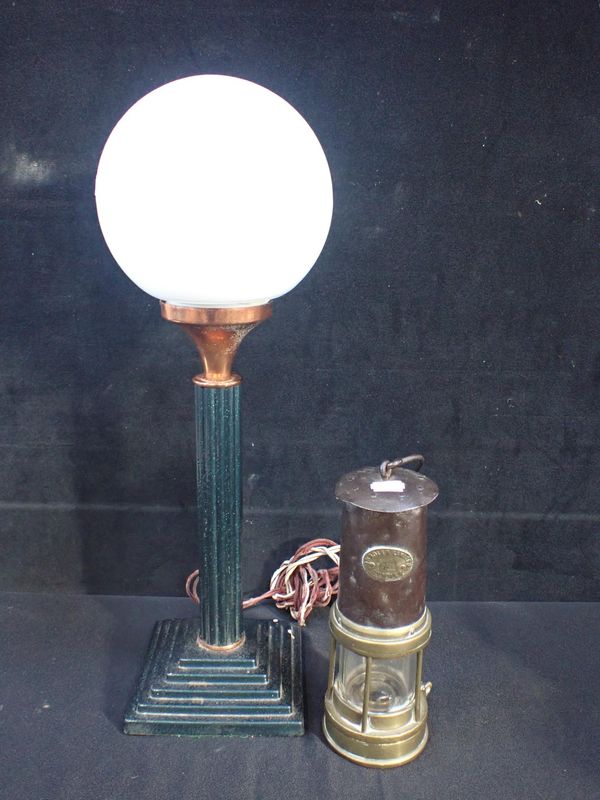 AN ART DECO STYLE TABLE LAMP WITH WHITE GLOBE SHADE