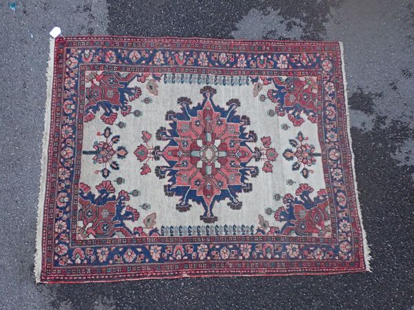 AN ANTIQUE N. W. PERSIAN RUG