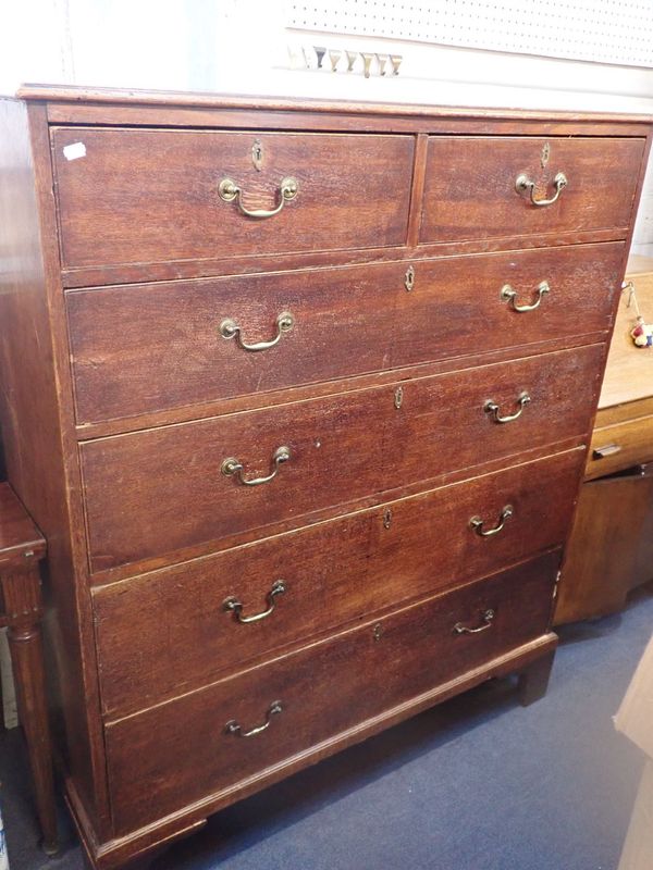 A GEORGE III TALL OAK CHEST OF DRAWERS