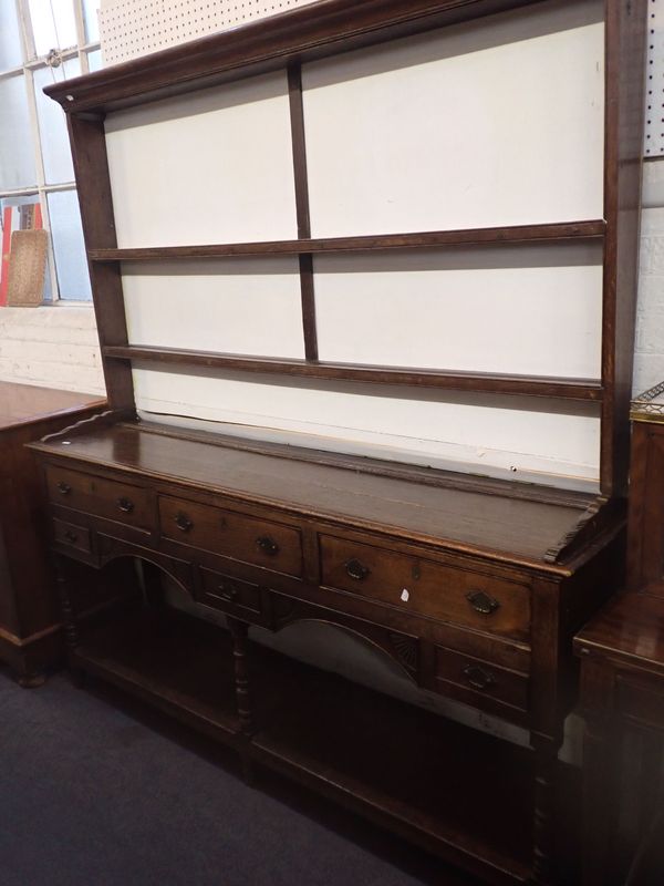 A GEORGE III OAK DRESSER, WITH POTBOARD BASE