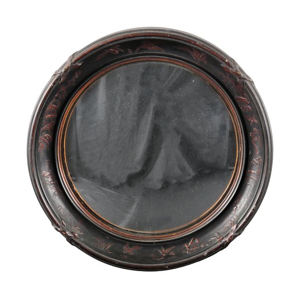 A FRENCH EBONISED CONVEX MIRROR